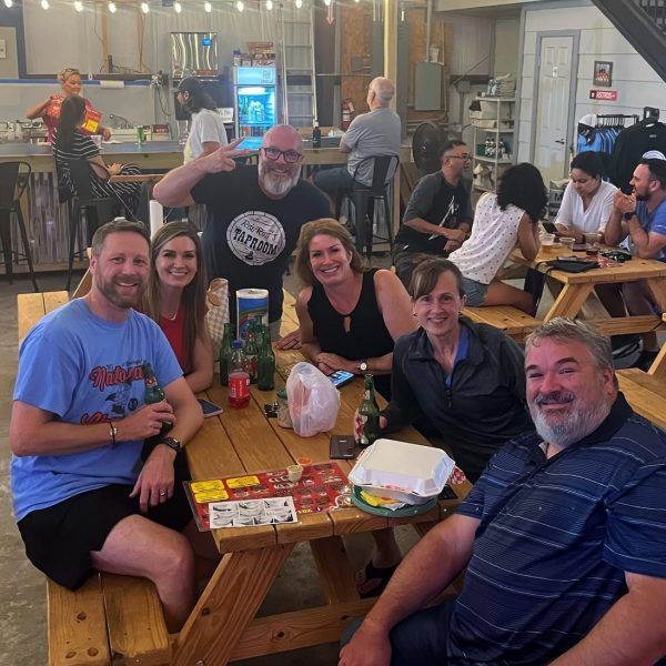Group Poses with Owner at Rob Ray's Taproom in Pearland